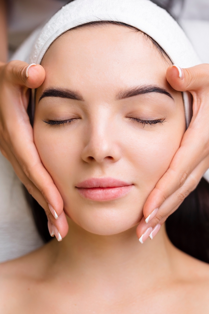 Young Woman getting a relaxing facial near Park Ave, NY